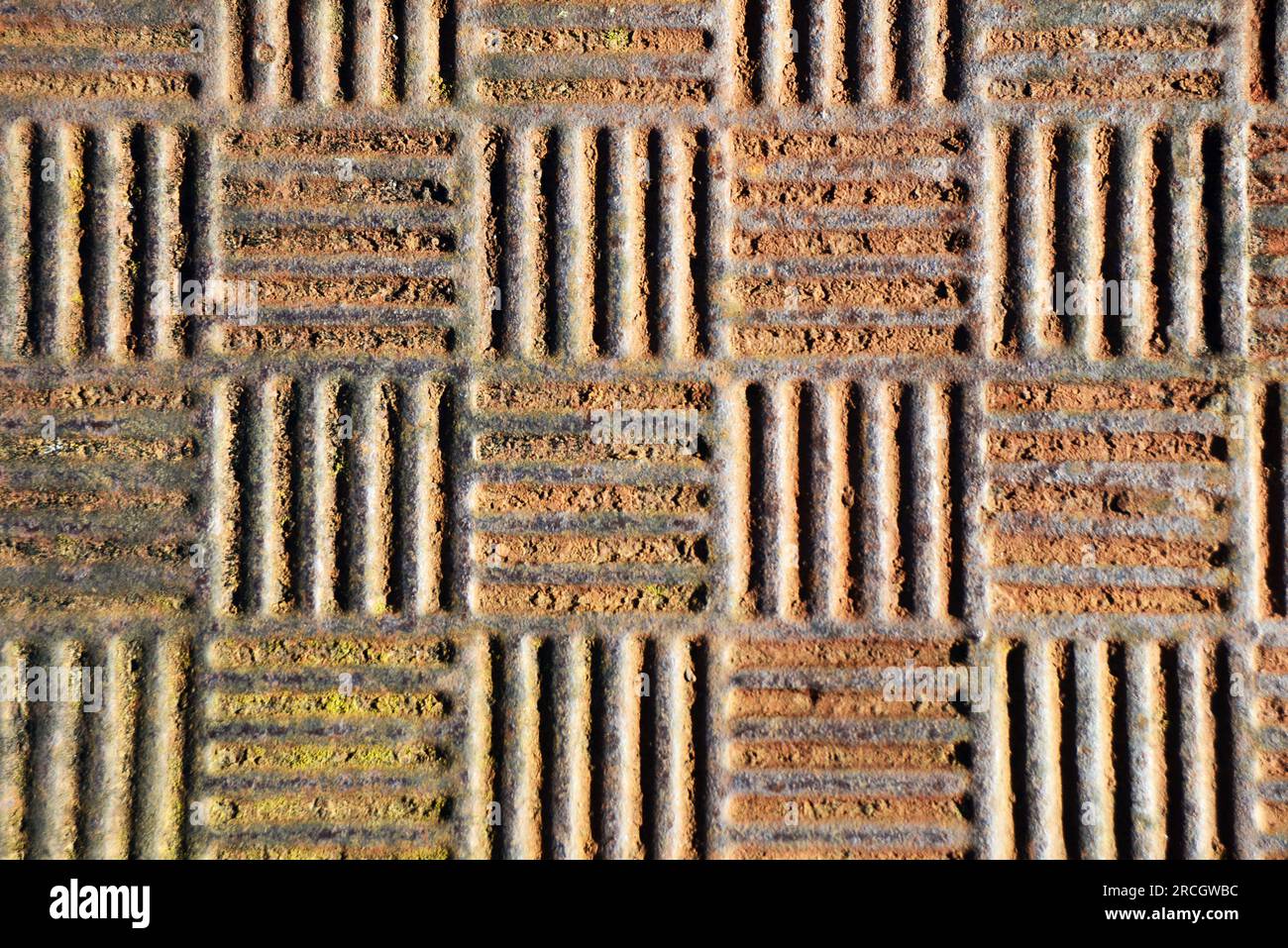 industrial background of a rusted manhole cover Stock Photo