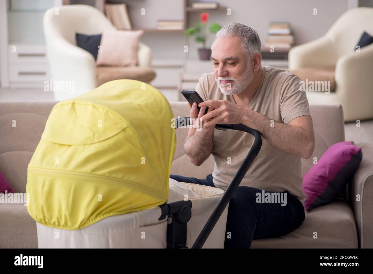 Grandparent looking after grandchild hires stock photography and