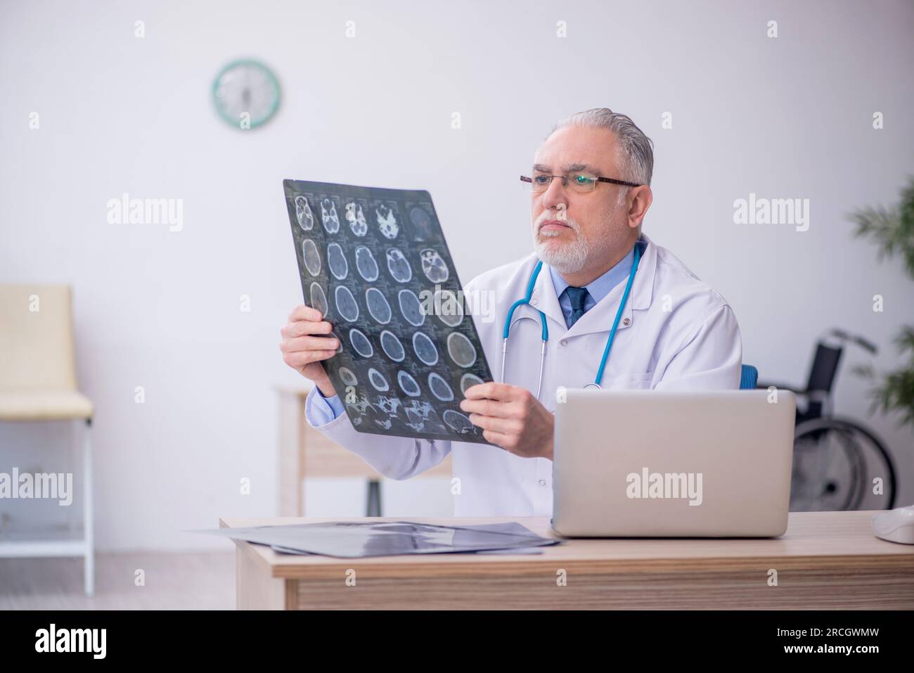 Old doctor radiologist working at the hospital Stock Photo - Alamy