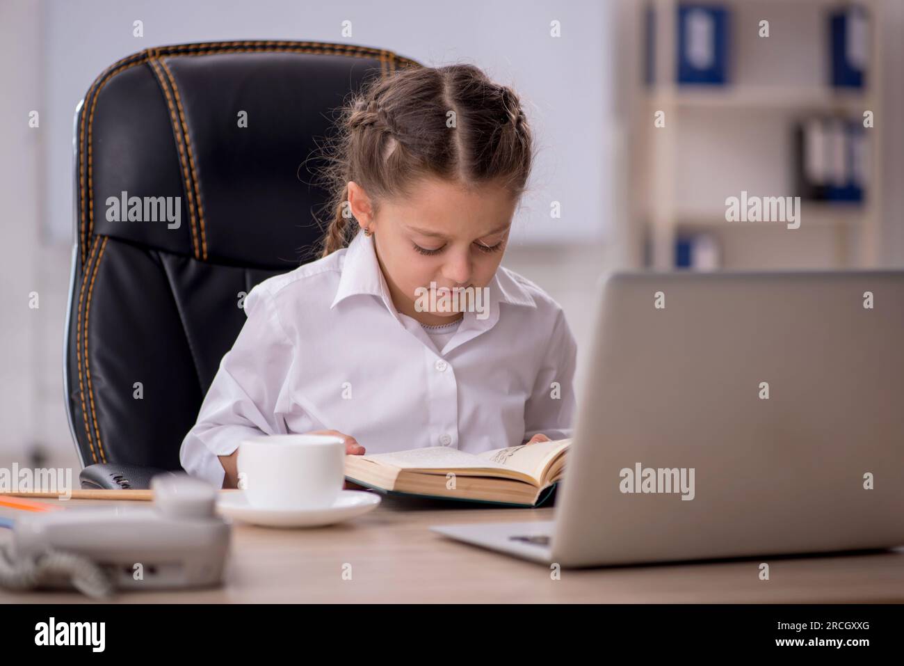 Little girl sitting in the classroom Stock Photo - Alamy