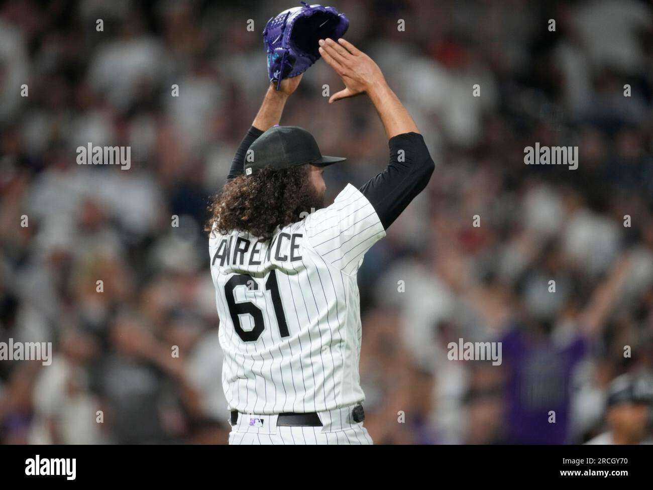 Colorado Rockies relief pitcher Justin Lawrence celebrates after left