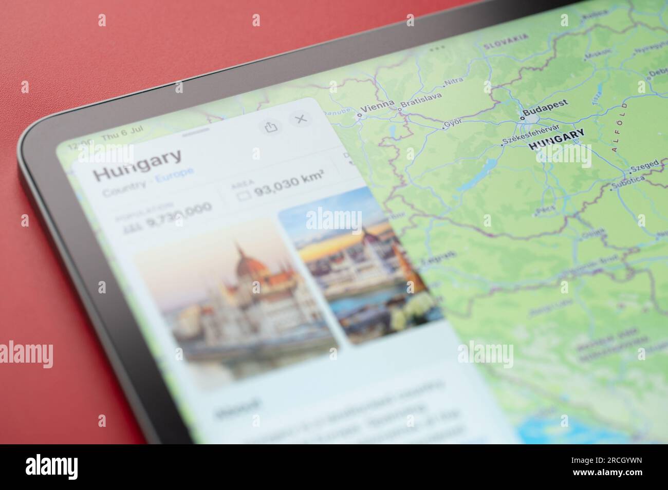 New York, USA - July 6, 2023: Contour of Hungary country boarder on world apple map ipad close up view Stock Photo