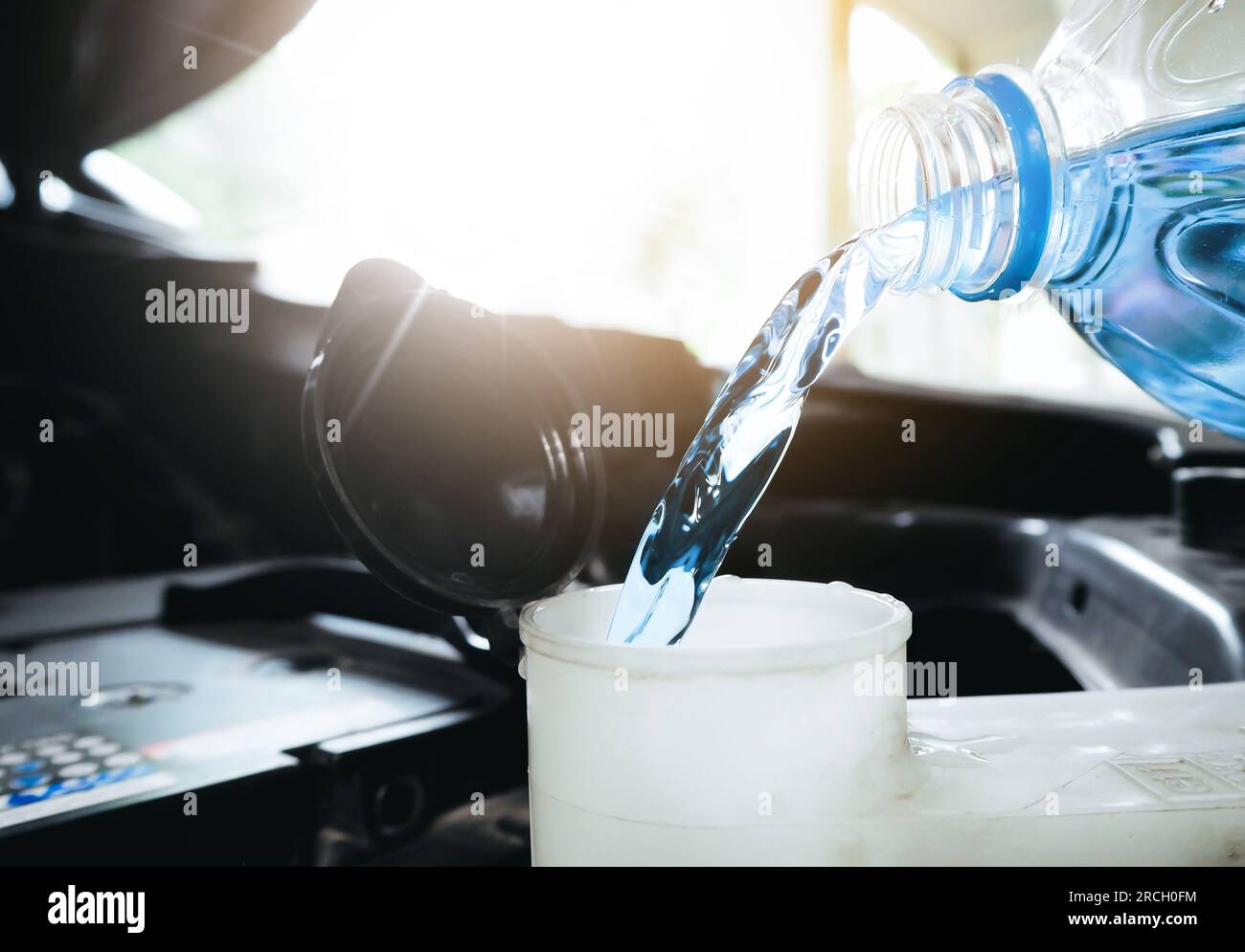 Pouring Liquid from Plastic Canister into Car Washer Fluid Reservoir. Close  Up Filling Windscreen Water Tank with Washing Liquid Stock Photo - Image of  closeup, tank: 202444560