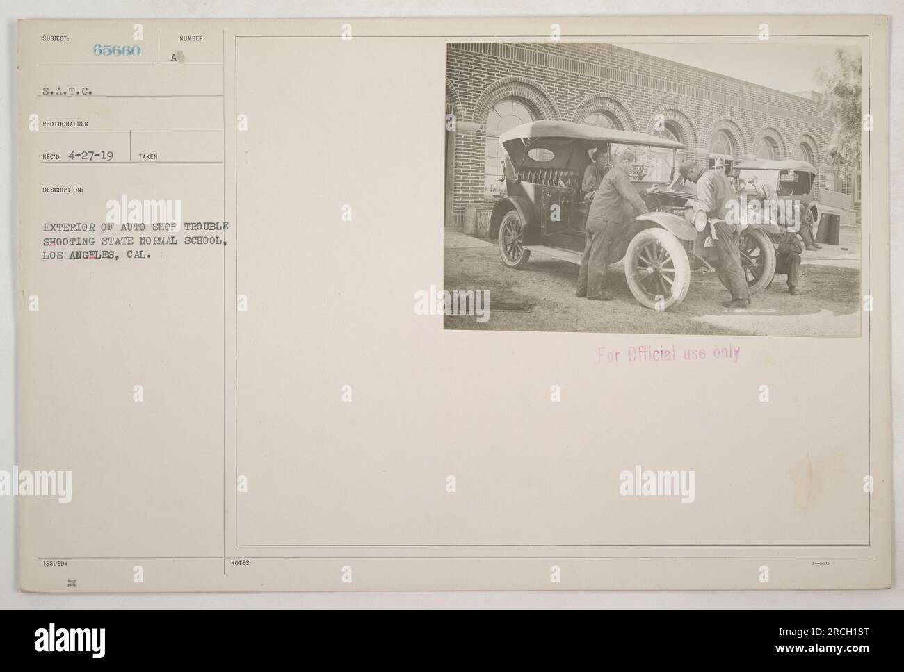 Exterior view of the Auto Shop Trouble Shooting building at the State Normal School in Los Angeles, California. The photograph was taken by photographer Reco on April 27, 1919, and is labeled with the description '65660.' It was issued for official use only, with the notation '3-M.' Stock Photo