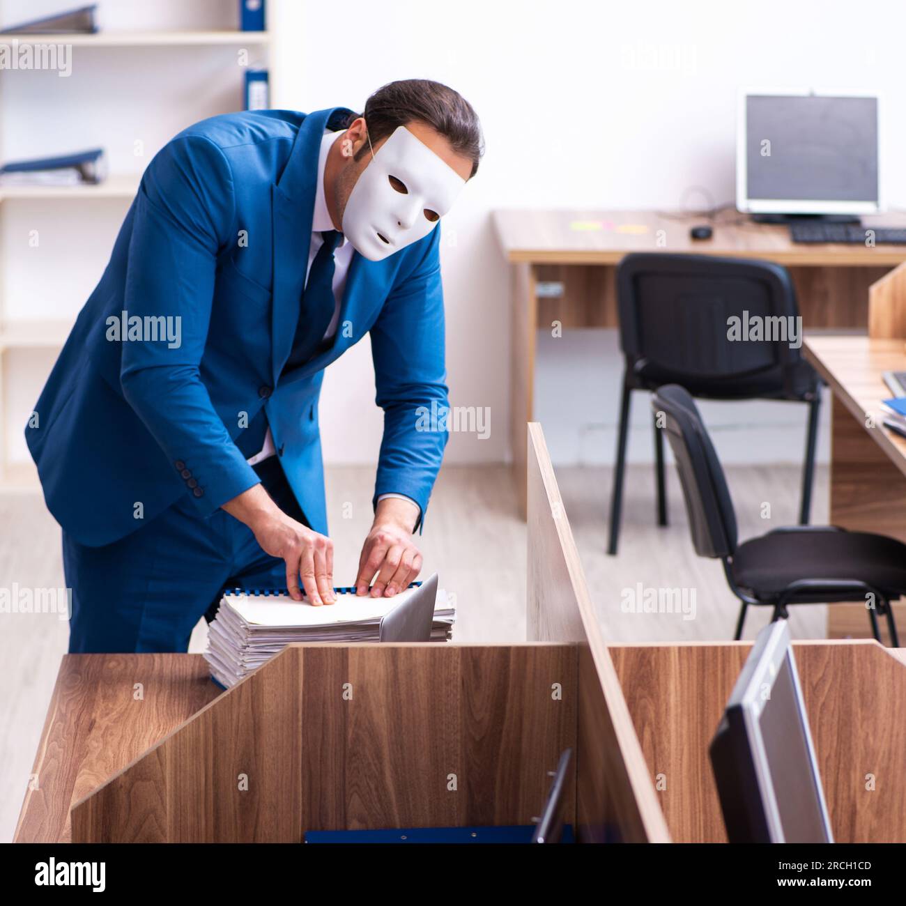 Young man wearing anonymous mask hi-res stock photography and images ...