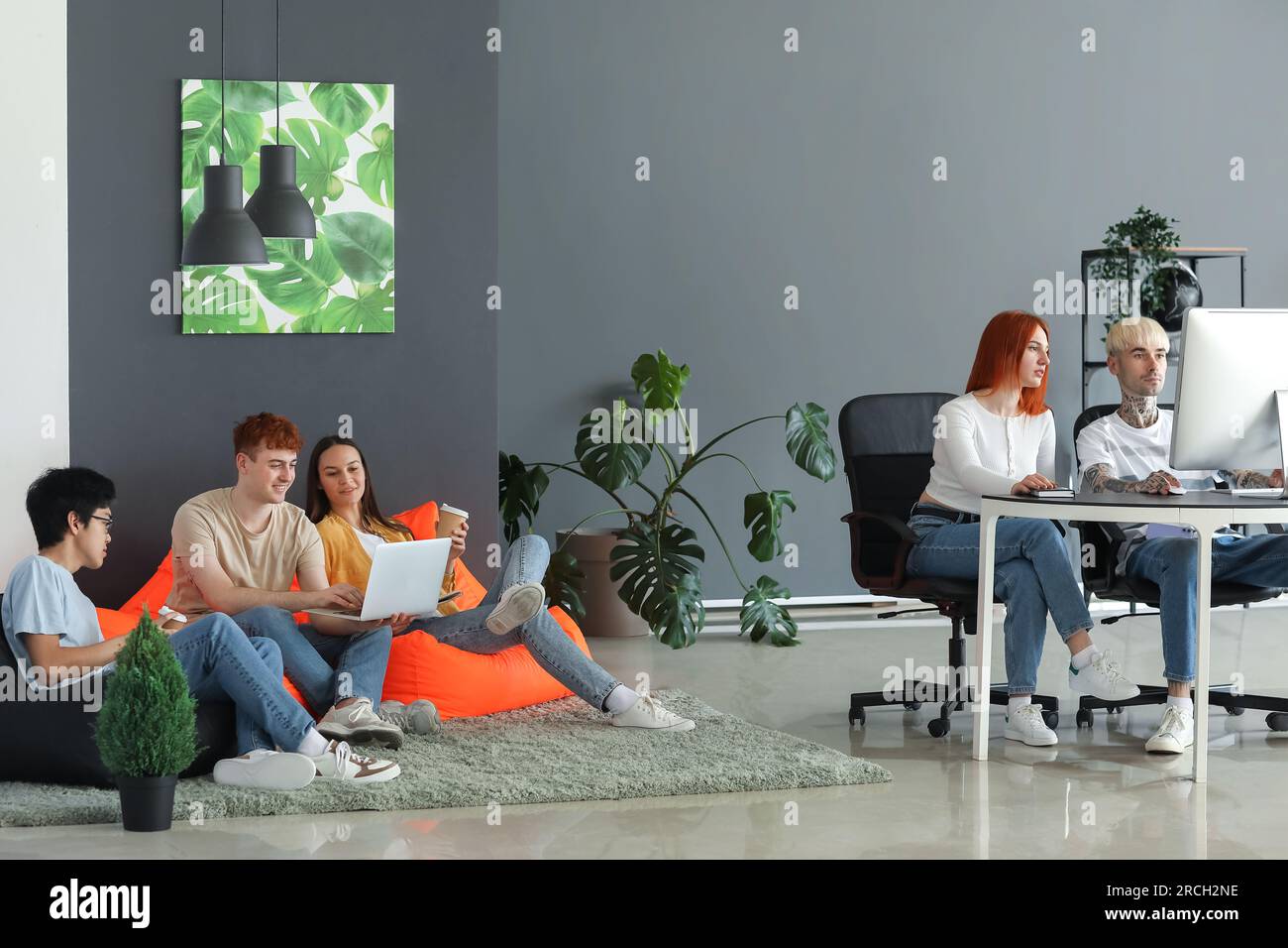 Team of young programmers working in office Stock Photo