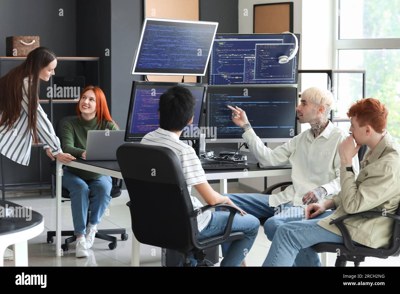 Team of young programmers working in office Stock Photo