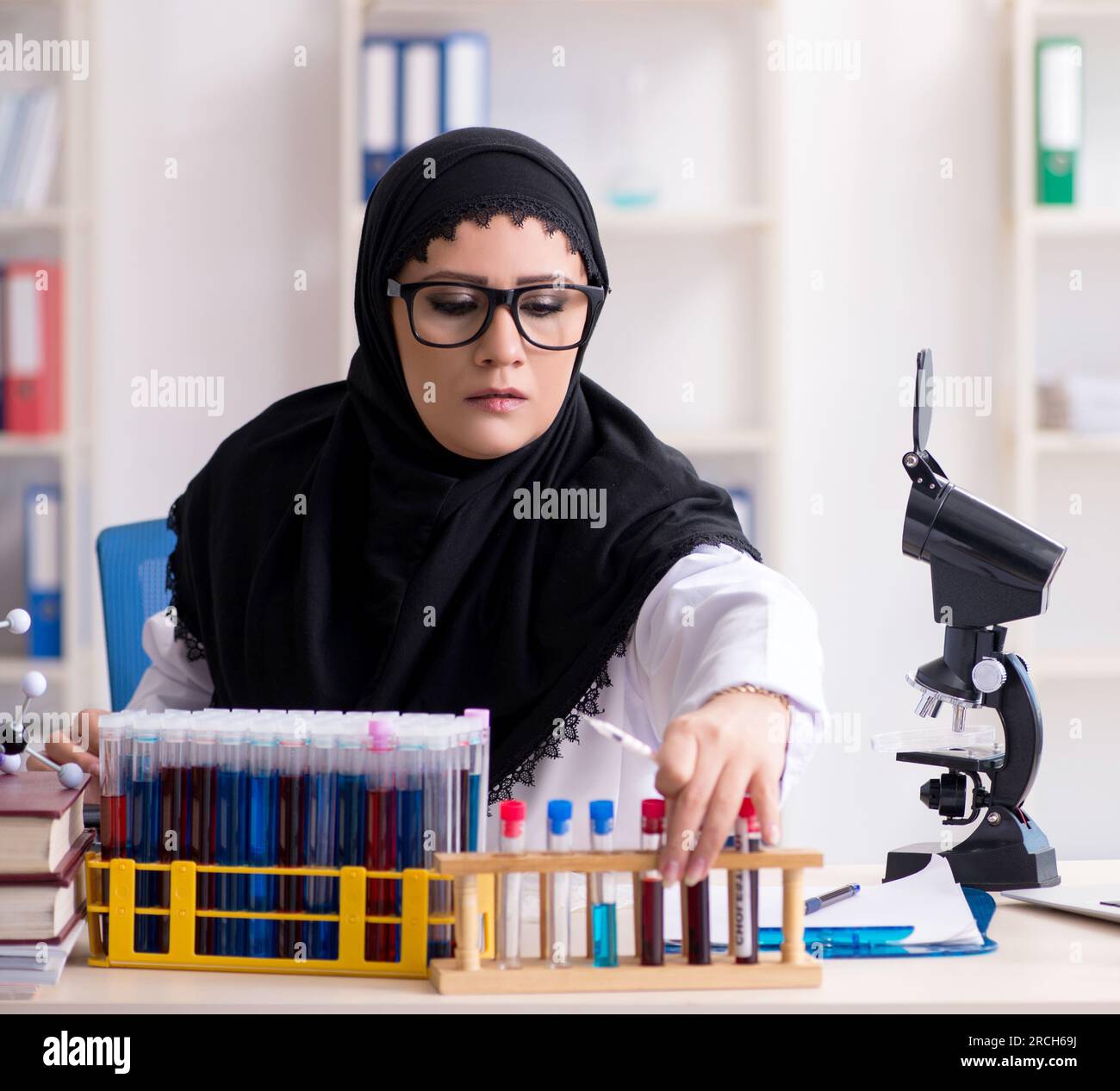 The female chemist in hijab working in the lab Stock Photo - Alamy