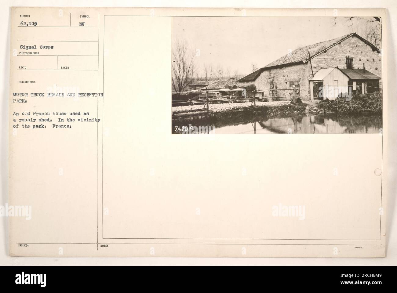 An old French house used as a repair shed at the Motor Truck Repair and Reception Park in France during World War One. This photograph, taken by the Signal Corps, has the photo number 62,019 and was described as a symbol issued by the Motor Truck Repair and Reception Park. Stock Photo