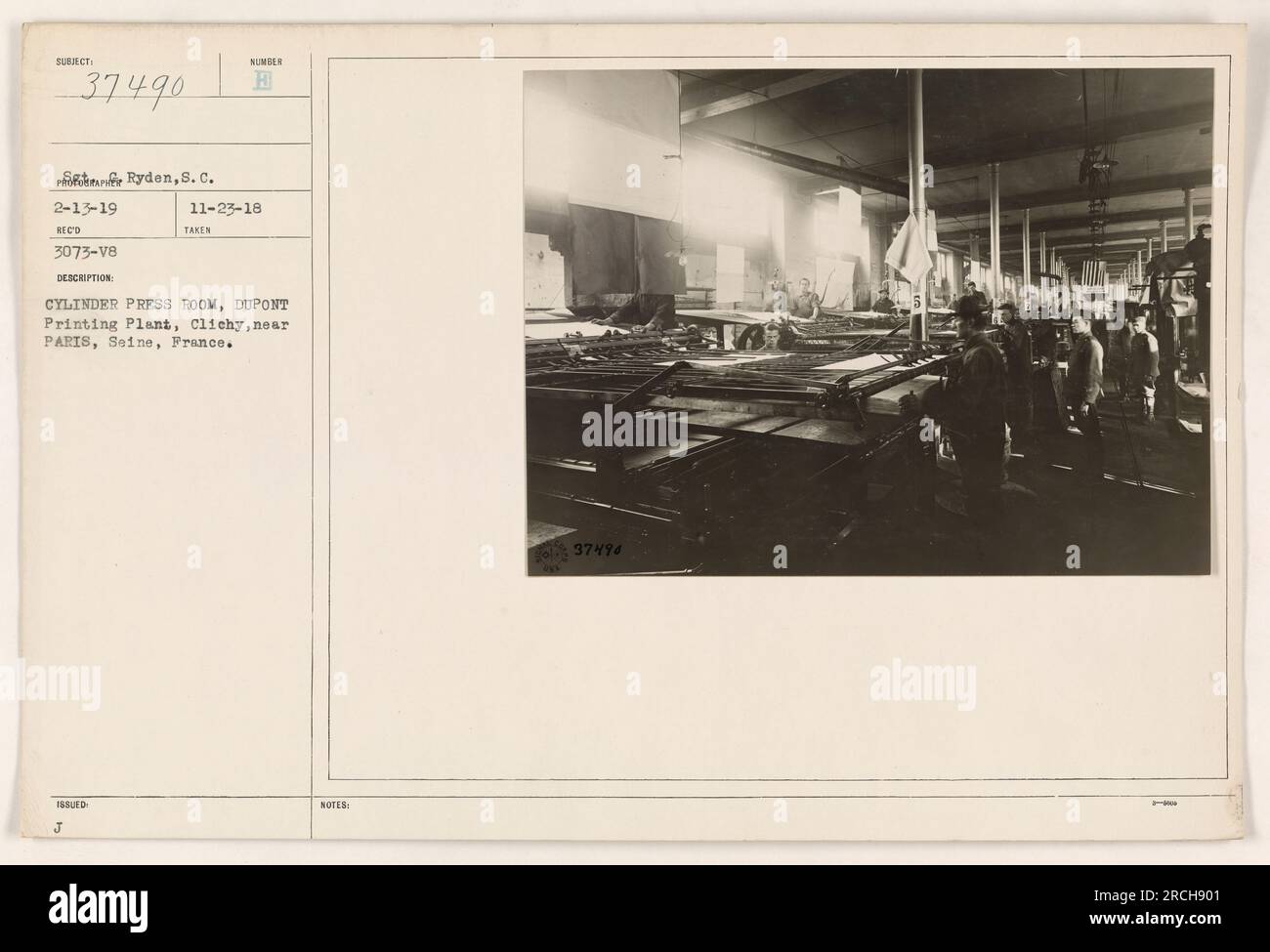Image depicting the interior of the cylinder press room at the DuPont Printing Plant in Clichy, near Paris, France. The photograph was taken during World War I and is part of the collection of American military activities. It was issued on November 23, 1918, with the reference number 37490. Stock Photo