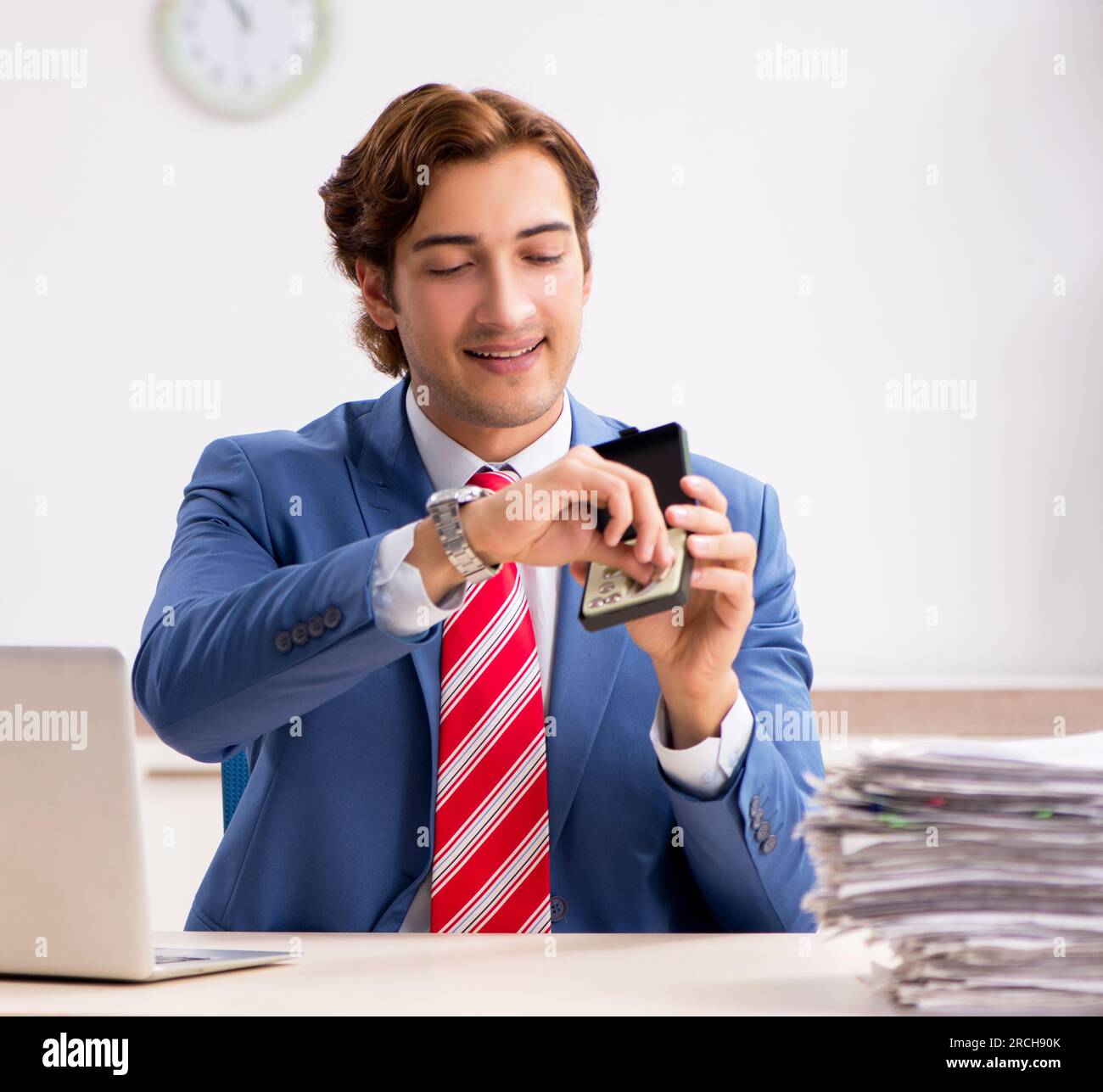 The deaf employee using hearing aid in office Stock Photo Alamy
