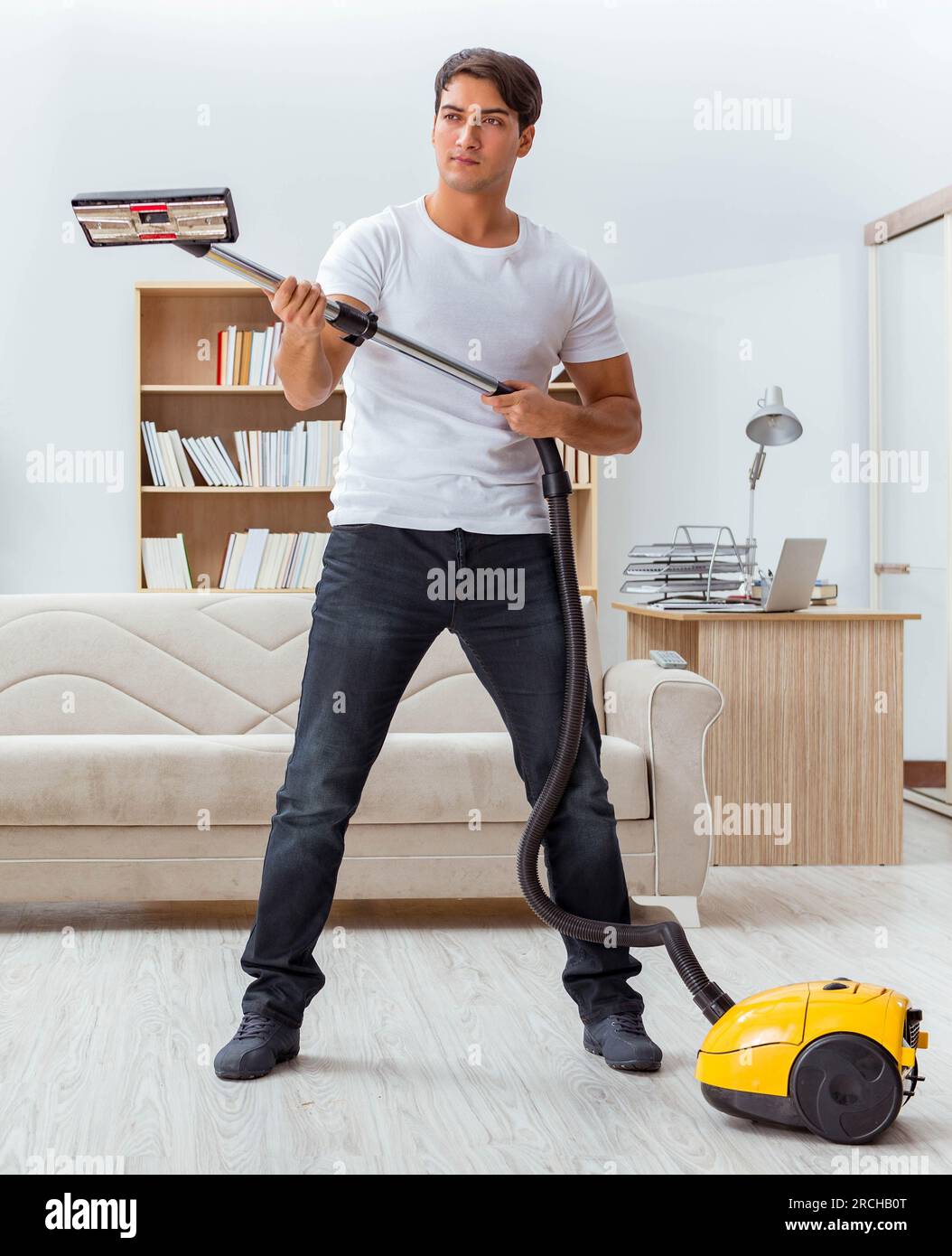 Man husband cleaning the house helping wife Stock Photo - Alamy