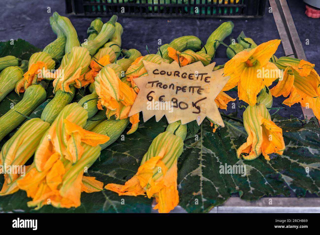 Traditional delicacy from South of France courgette or zucchini flowers at an outdoor farmers market Cours Saleya in the Old Town Nice, French Riviera Stock Photo