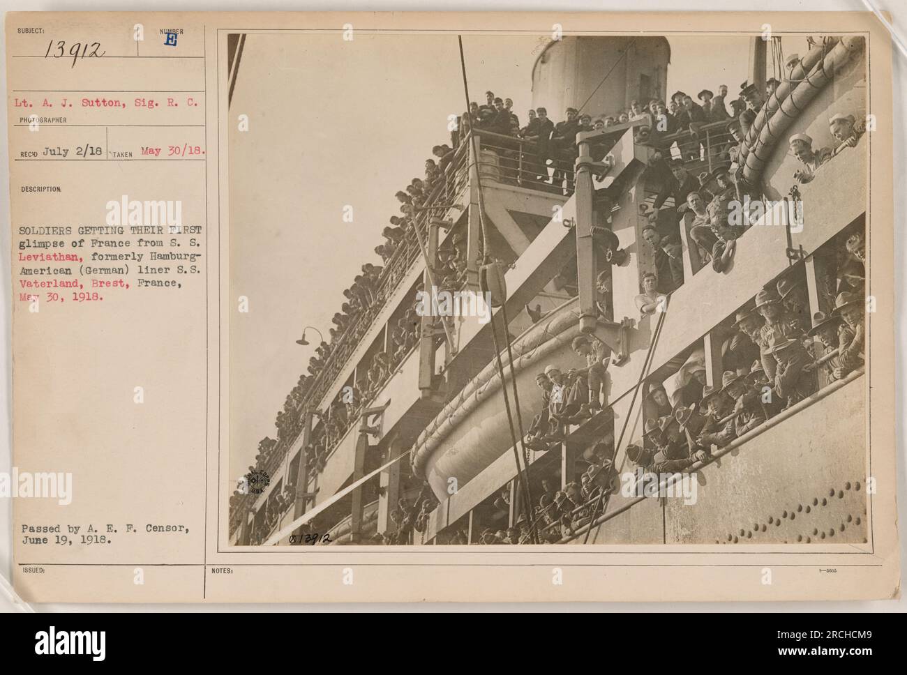 Soldiers getting their first glimpse of France from the S.S. Leviathan (formerly S.S. Vaterland), a former German ship, in Brest, France on May 30, 1918. The photo was taken by Lt. A.J. Sutton, who served in the Royal Corps of Signals. It was passed by the A.E.F. censor on June 19, 1918. Stock Photo