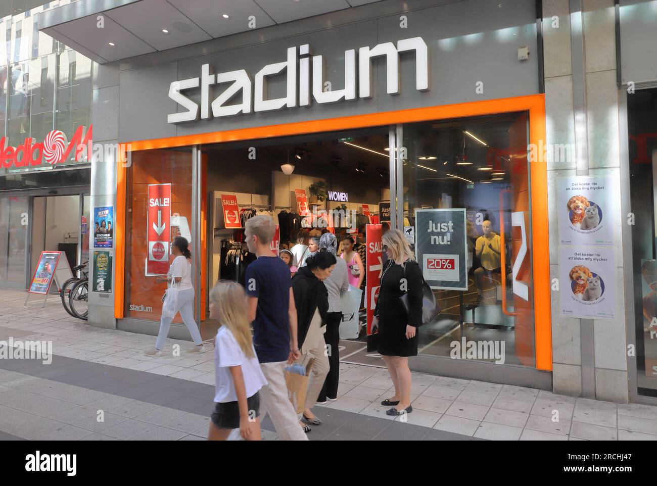 Stockholm, Sweden - July 14, 2023: People outside the sport shop Stadium located at the Drottninggatan street. Stock Photo