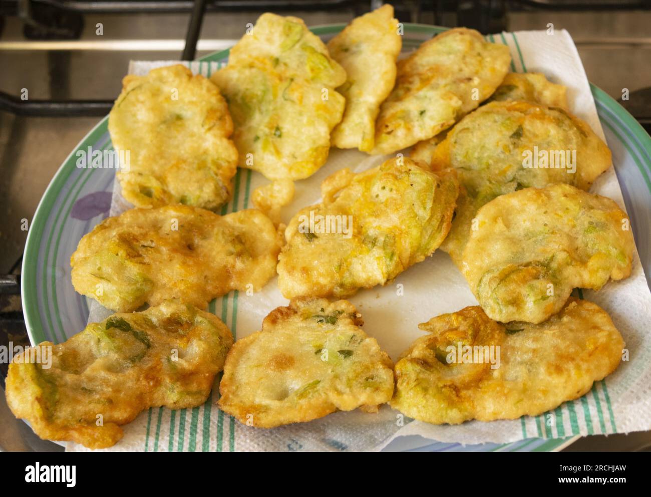 fried zucchini fritters freshly fried in a pan Stock Photo