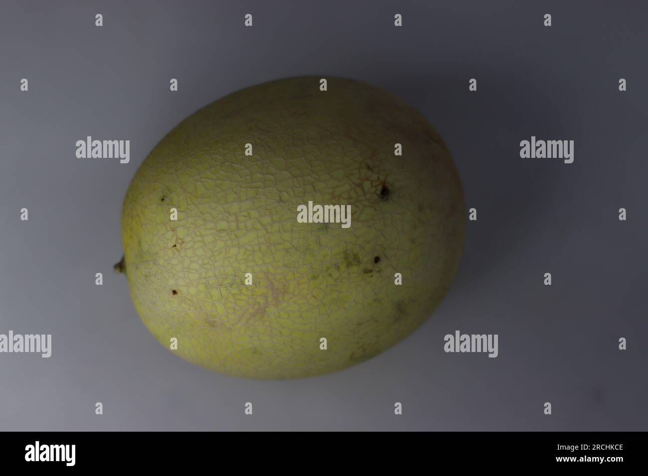 Honeydew Melon. It is one of the two main cultivar types in Cucumis melo Inodorus Group. It is characterized by the smooth rind and lack of musky odou Stock Photo