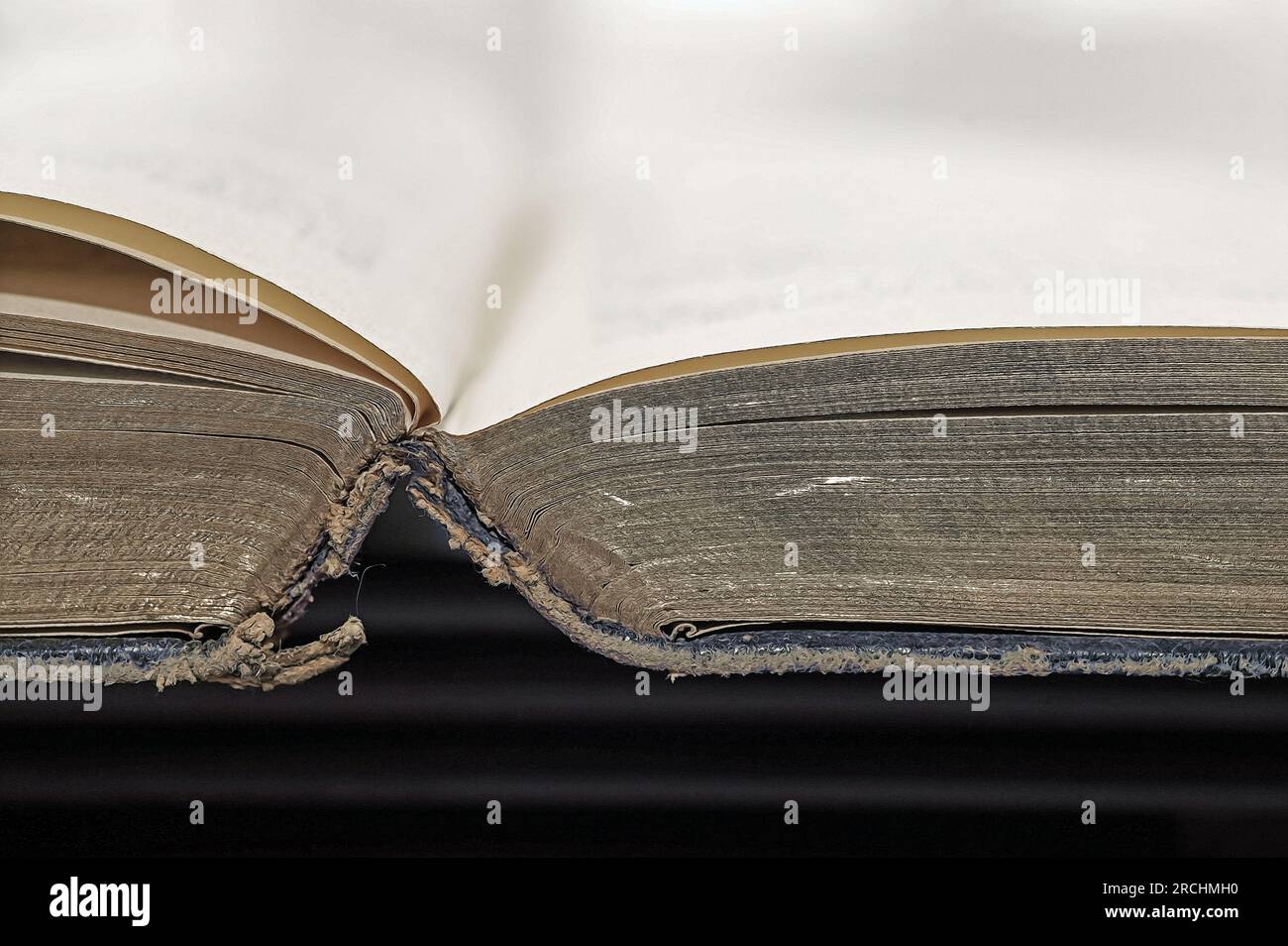An open book. An antique worn open book seen from the top with page ...