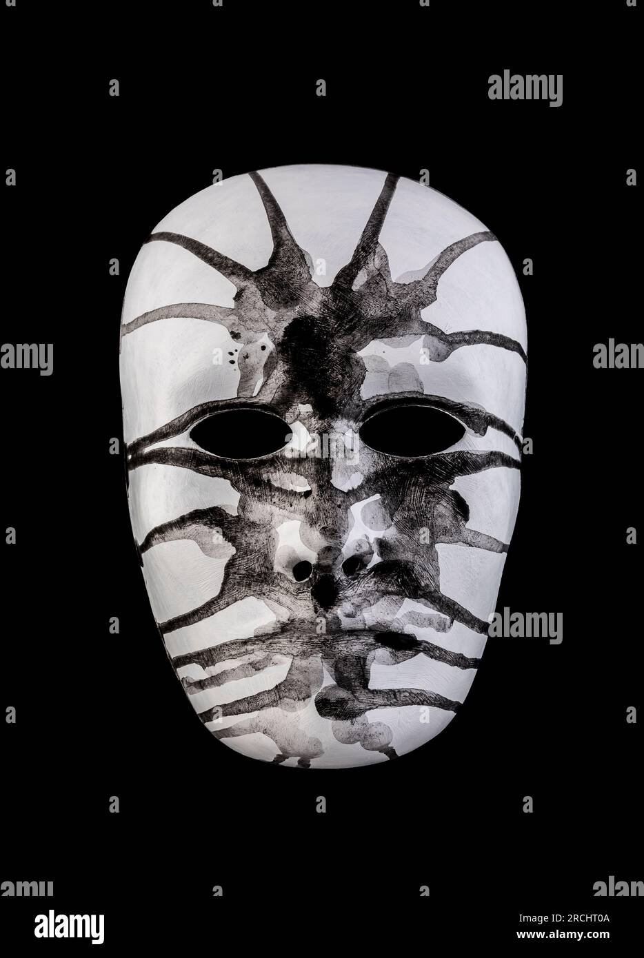 Scary white head painted black isolated on black background Stock Photo