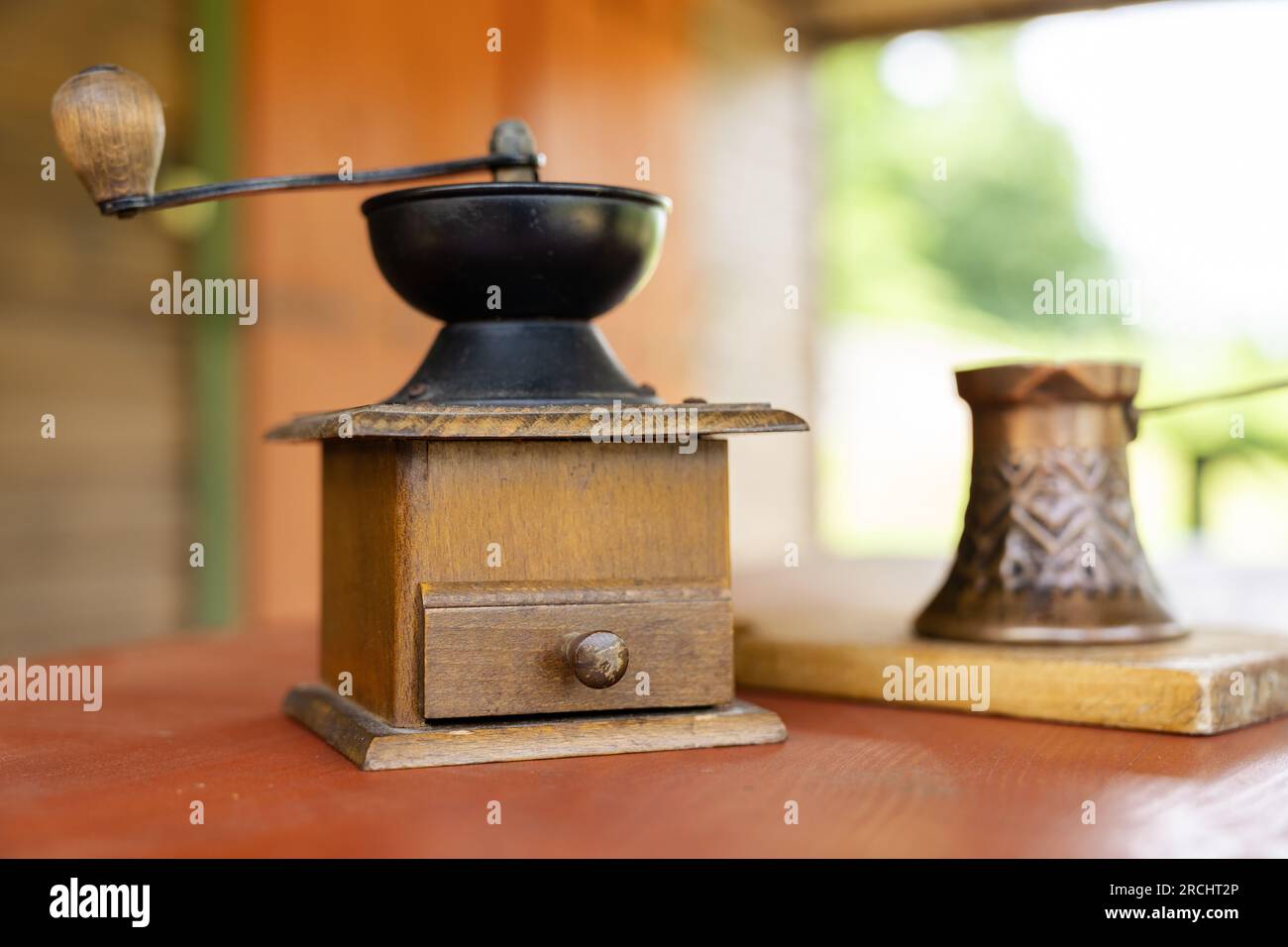 Vintage coffee pot and manual coffee grinder. Retro style of making natural espresso Stock Photo