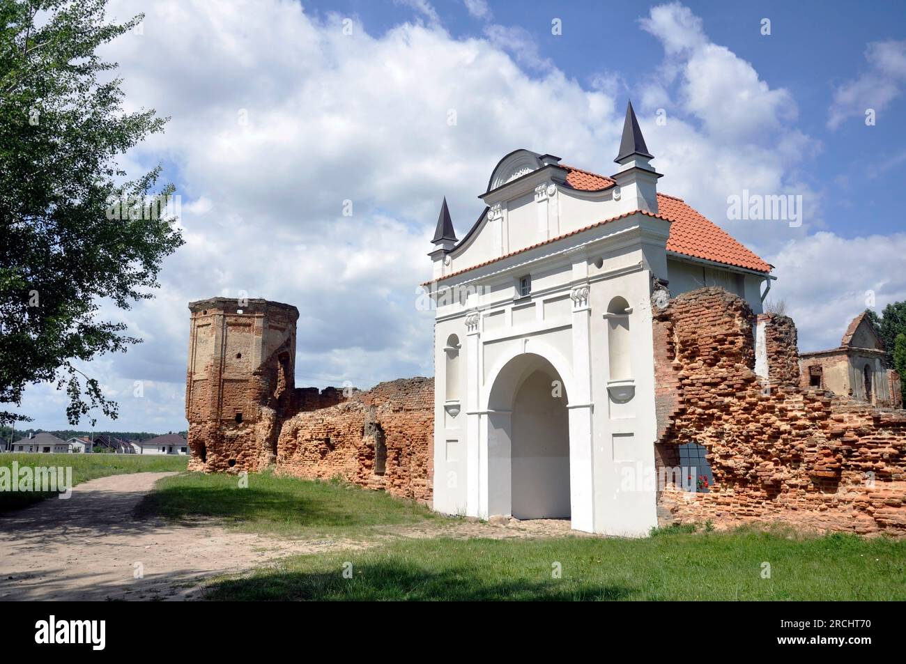 Restored entrance gate and remains of the walls of the Carthusian monastery of 1648-1666 in the town of Bereza, Belarus. Stock Photo