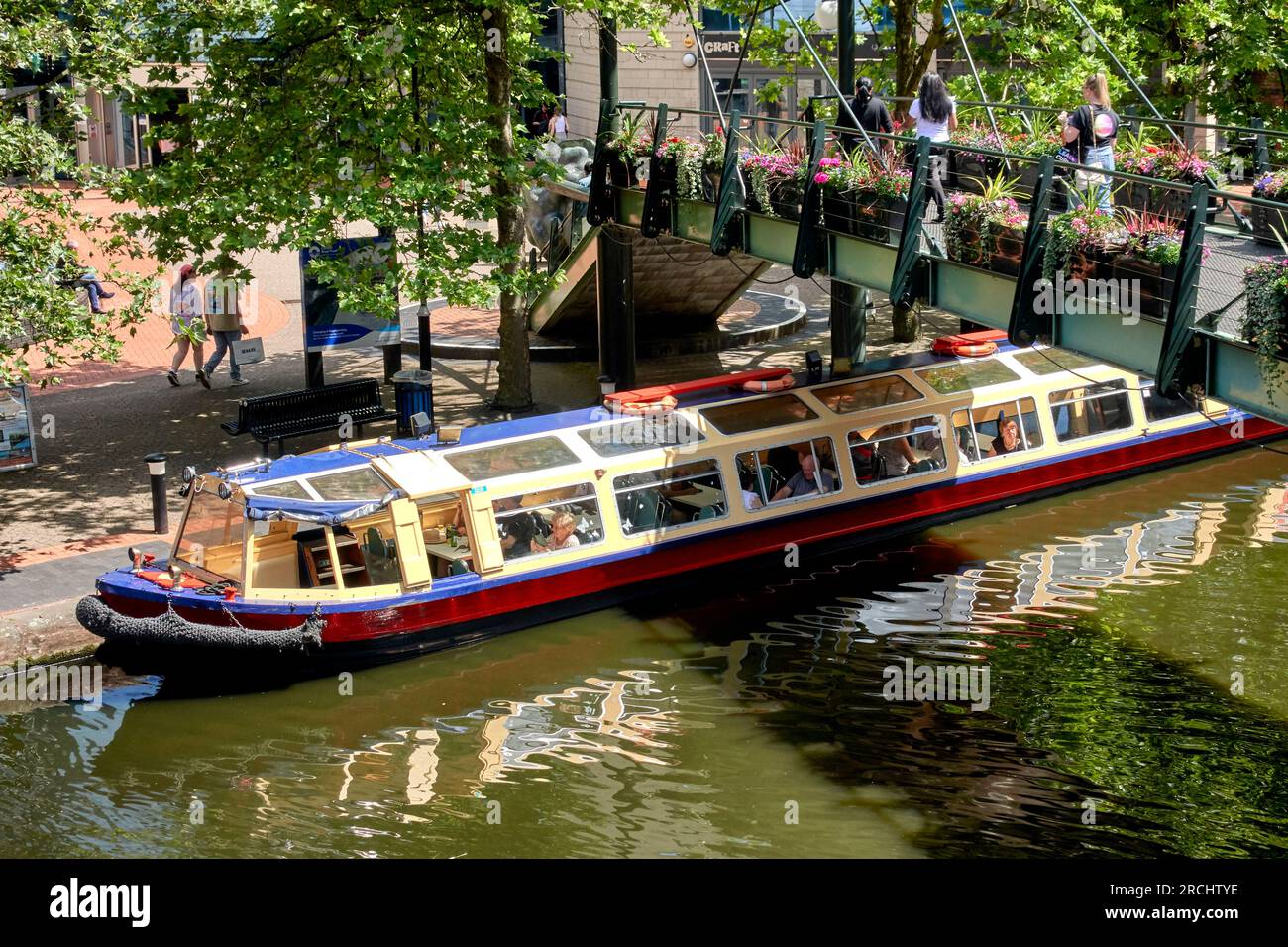 Tourist pleasure boat cruise at Brindley Place, canal, Birmingham England  UK Stock Photo