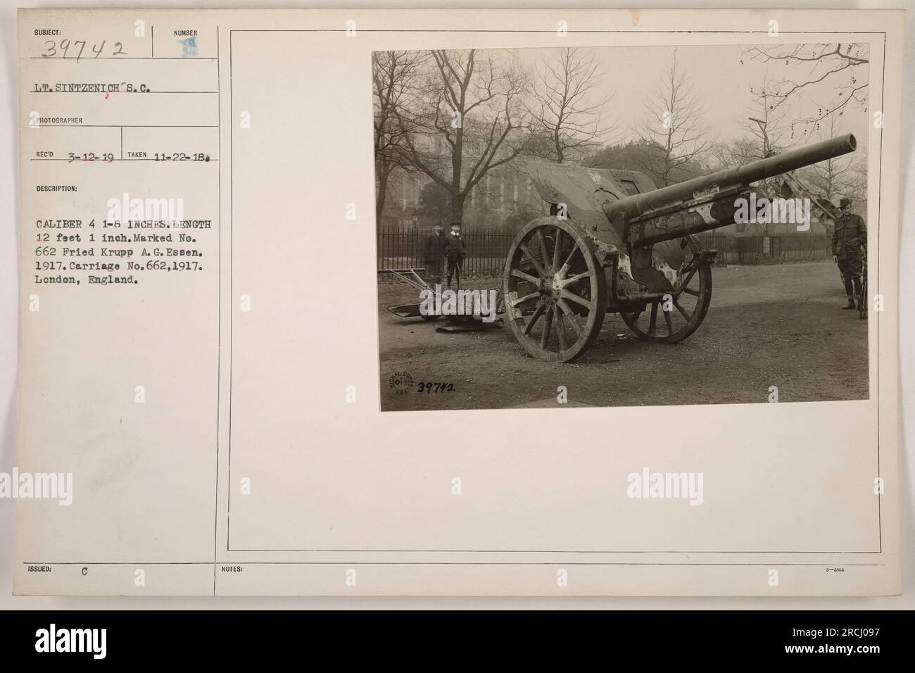 Lt. Sintzenich is shown in this photograph. The image provides details on a military artillery piece, a caliber 4 1-8 inch, measuring 12 feet 1 inch, marked No. 662 Fried Krupp A. G. Essen. 1917. The carriage is also marked No.662, manufactured in 1917 in London, England. The photograph was taken on November 22, 1918, as recorded by photographer RECO on March 12, 1919. The notes also reference number 39742. Stock Photo