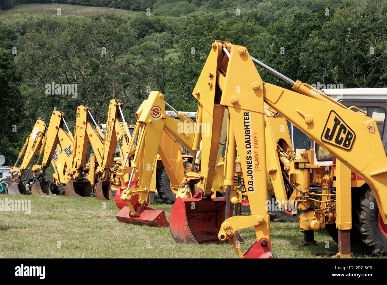 A row of JCB diggers at the Neath Steam and Vintage show Neath and Port Talbot Wales Stock Photo