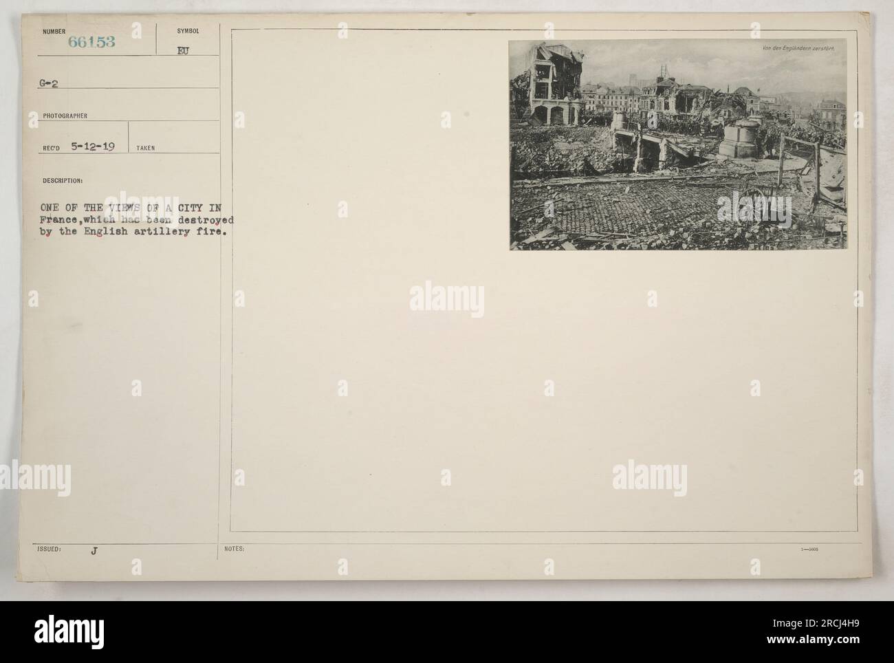 This photograph shows a view of a city in France that has been severely damaged due to English artillery fire during World War One. The photo was taken on May 12, 1919, and the photographer's notes mention the destruction caused by the Englis artillery. Stock Photo