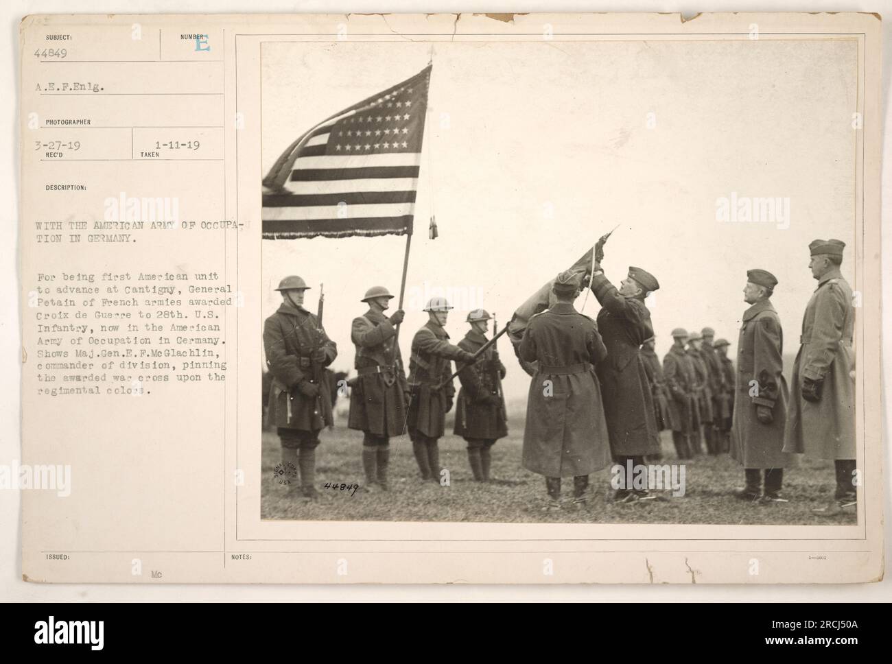Major General E.P. McGlachlin, commander of the division, awards the Croix de Guerre to members of the 28th U.S. Infantry. The 28th U.S. Infantry was the first American unit to advance at Cantigny. They are now part of the American Army of Occupation in Germany. Stock Photo