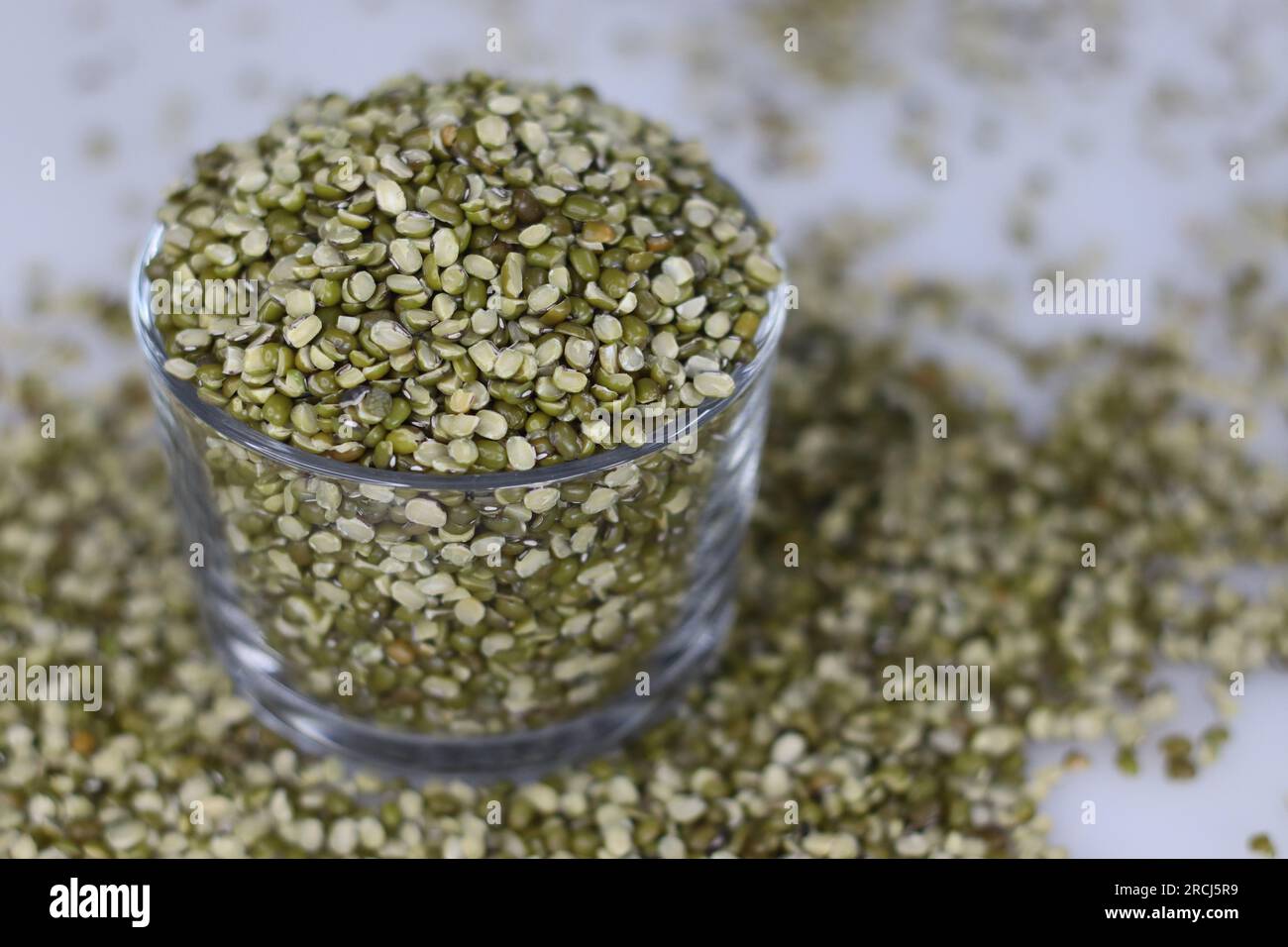 Split mung beans with skin is a legume, with green skin. It is also known as Vigna Radiata. It is highly nutritious with protein, antioxidants, phyton Stock Photo