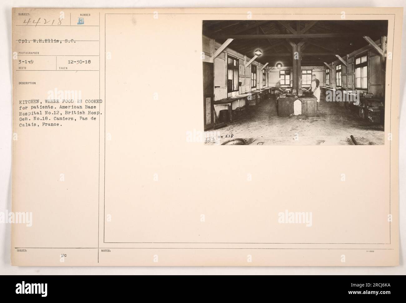 Cpl. W.H. Ellis is seen in this photograph taken at American Base Hospital No.12 in Camiers, France during World War One. The image shows the kitchen where food is cooked for patients, serving both American and British hospitals. The picture was taken on December 30, 1918. Stock Photo