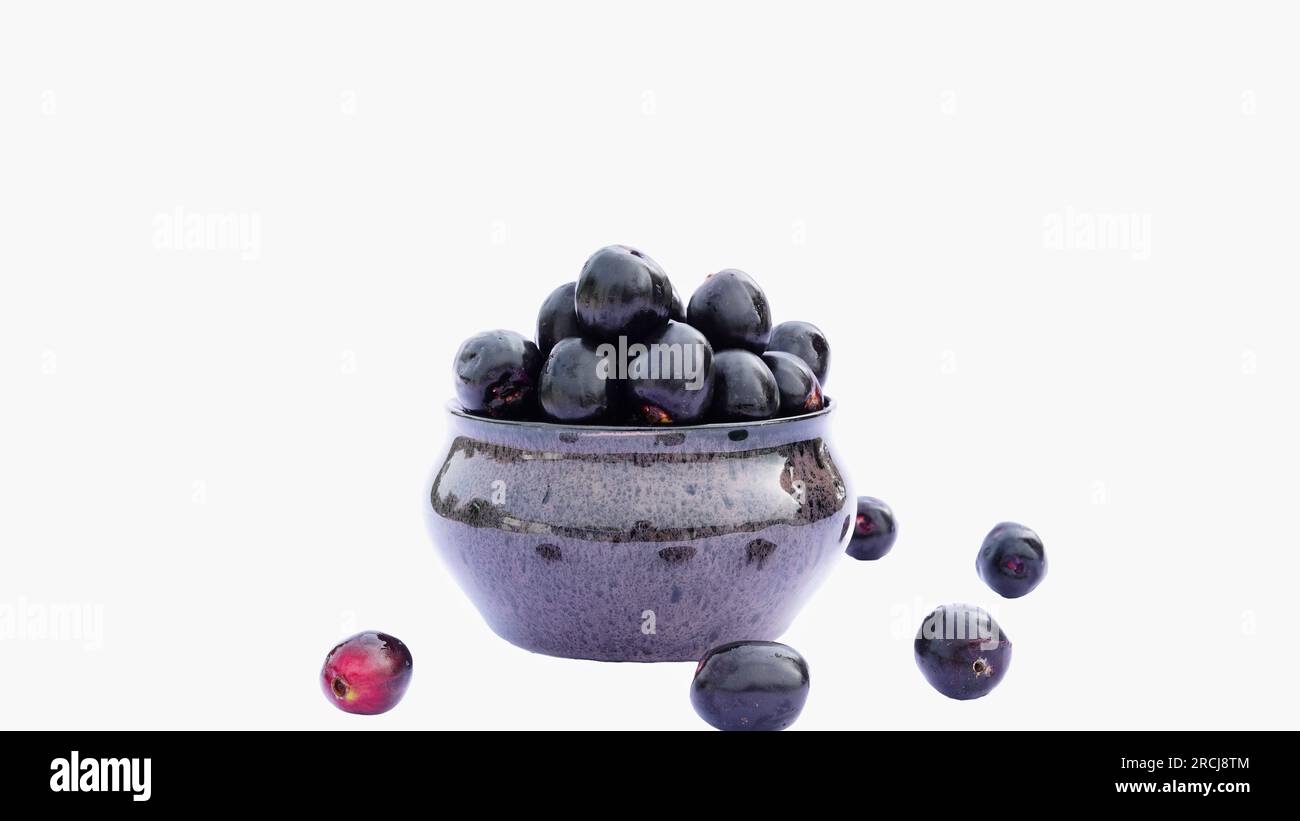 Jamun or Black Plum in a Ceramic Bowl with Leaves Isolated on White Background with Copy Space Stock Photo
