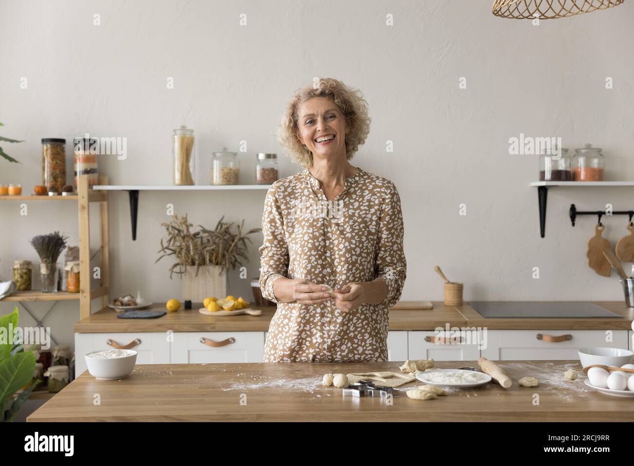 Mature woman rolling cookie hi-res stock photography and images - Alamy