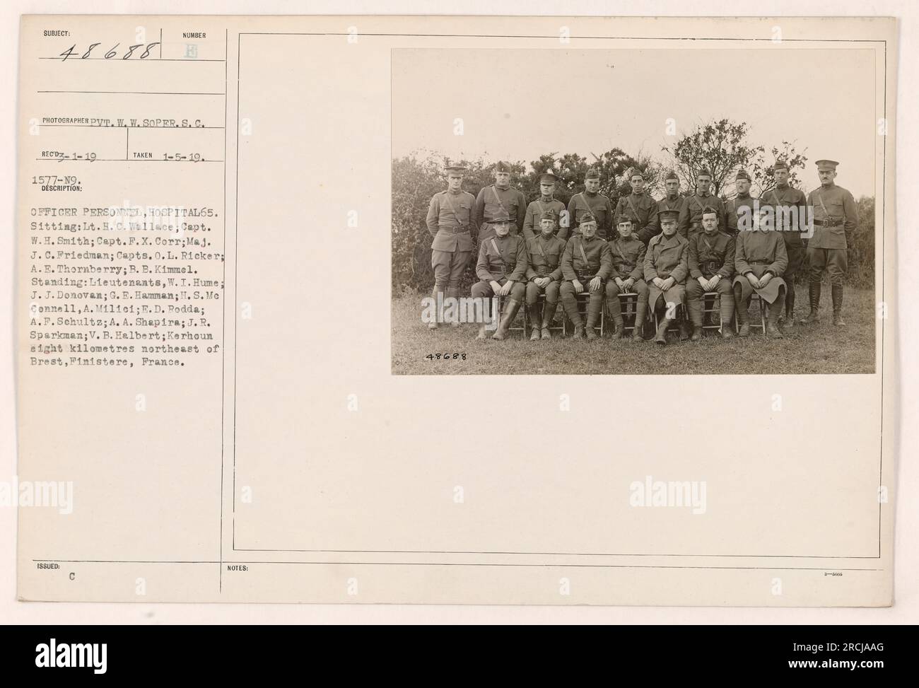 Officer personnel and doctors pose for a photograph at Hospital 65 located in Kerhoun, eight kilometers northeast of Brest, Finistere, France. Captains, lieutenants, and a major are among those featured in the image. The photograph was taken on January 5, 1919, by W. W. SOPER.S.C. MEDZ1-19 1577-19. Stock Photo