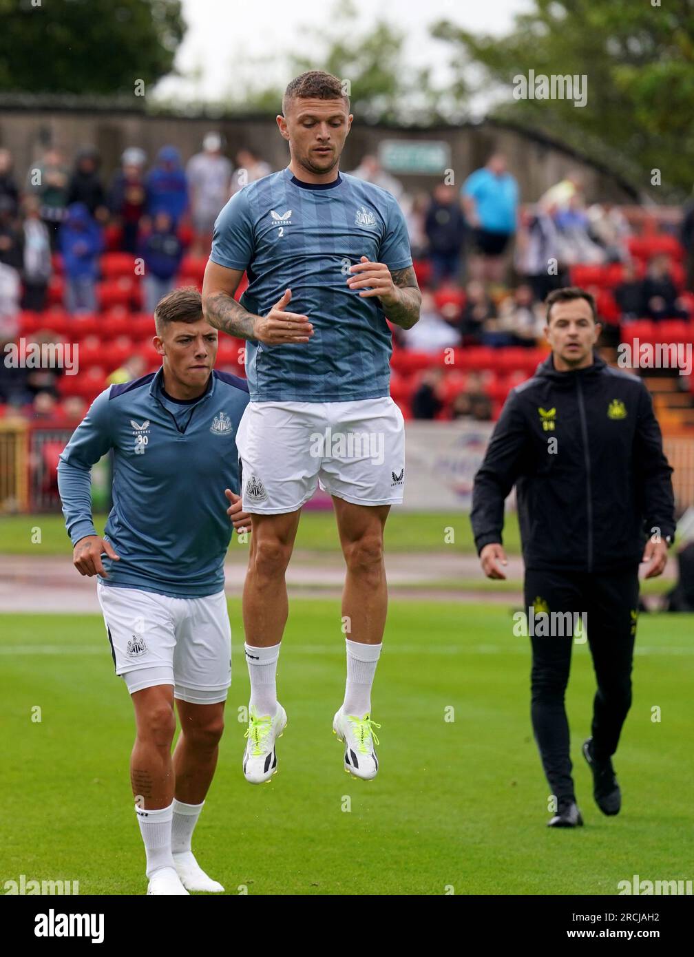 Newcastle United's Kieran Trippier (centre) during the warm up before the pre-season friendly match at the Gateshead International Stadium, Gateshead. Picture date: Saturday July 15, 2023. Stock Photo