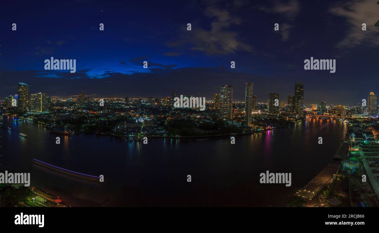 Panoramic aerial night picture of the Bangkok skyline and Chao Phraya river Stock Photo