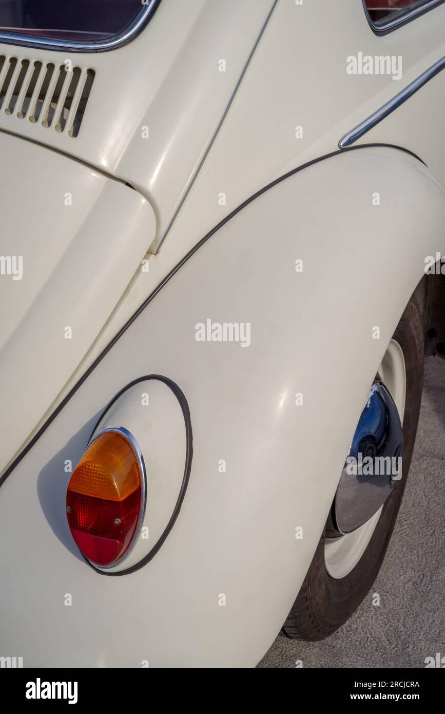 Close up detail of Volkswagen Beetle classic car parked in a street during raid of vintage cars Stock Photo