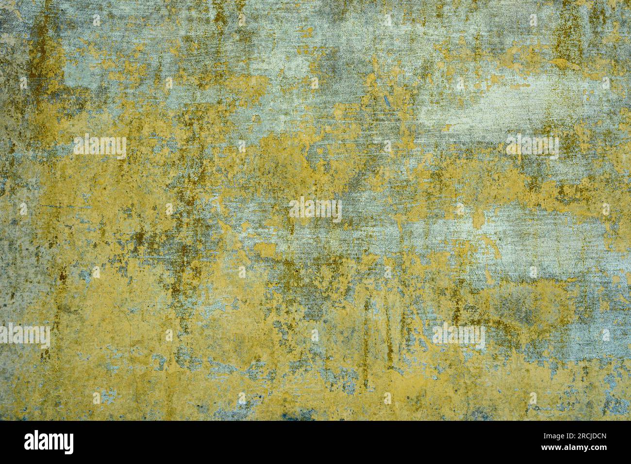 Background. Pattern. Yellow stained and worn concrete wall. Stock Photo