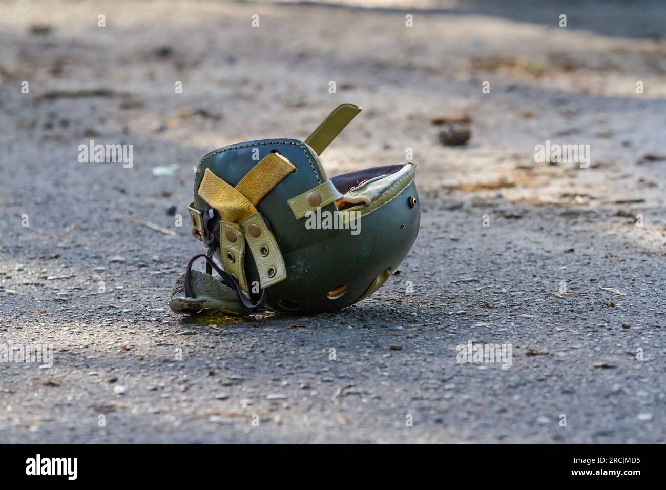 U.S. World War II tanker helmet lies on the ground Stock Photo