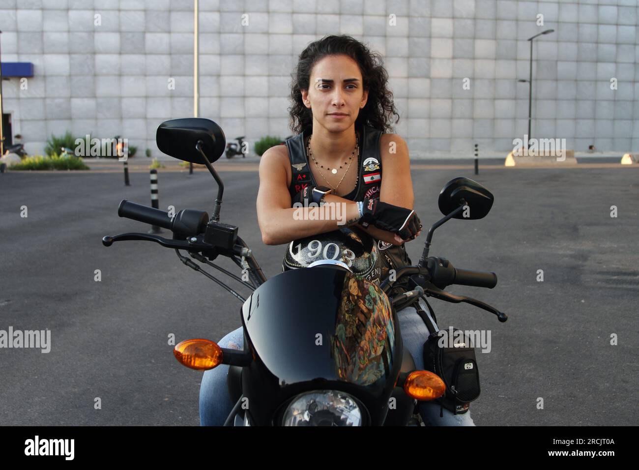 A woman driving the Harley Davidson which is rear in Lebanon. Stock Photo