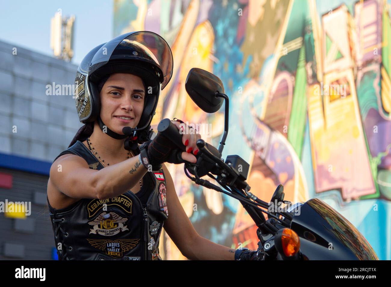 A woman driving the Harley Davidson which is rear in Lebanon. Stock Photo