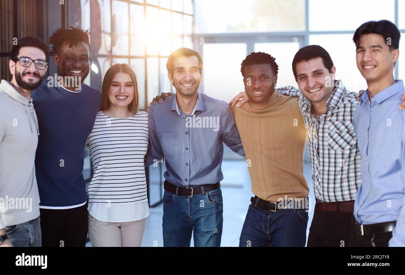 Positive multi racial corporate team posing looking at camera Stock Photo