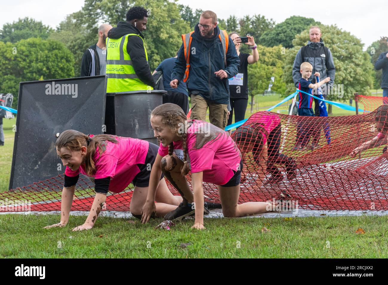 July 15th, 2023. The Reading Pretty Muddy Race for Life event took place in Prospect Park, Reading, Berkshire, England, over the weekend, with obstacle races for kids and adults. The charity event raises money for Cancer Research UK. Stock Photo
