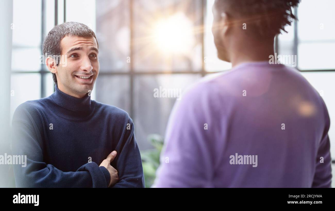 Two young diverse male colleagues hi-res stock photography and images ...