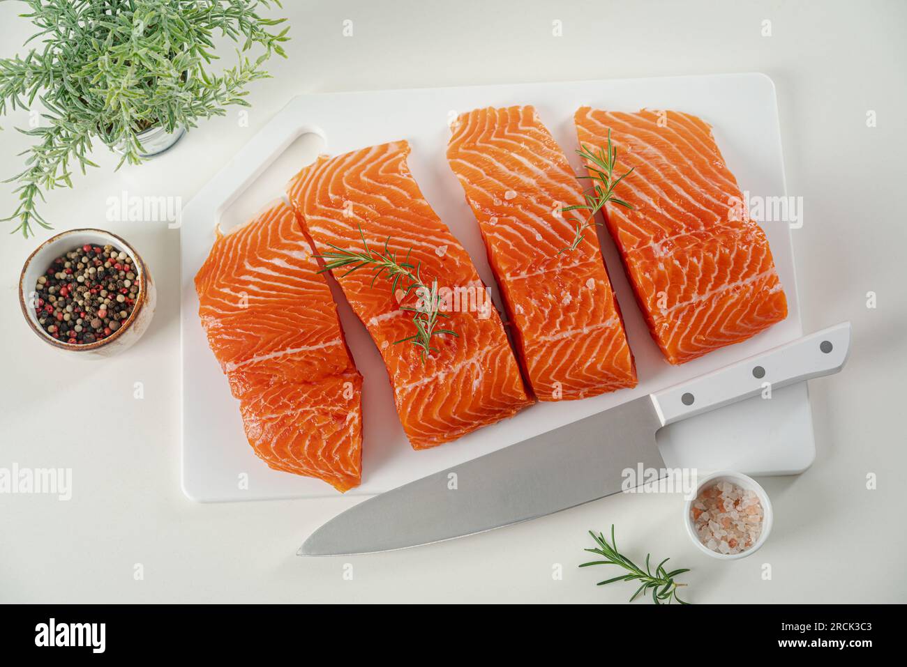 Raw salmon fish fillet Stock Photo - Alamy