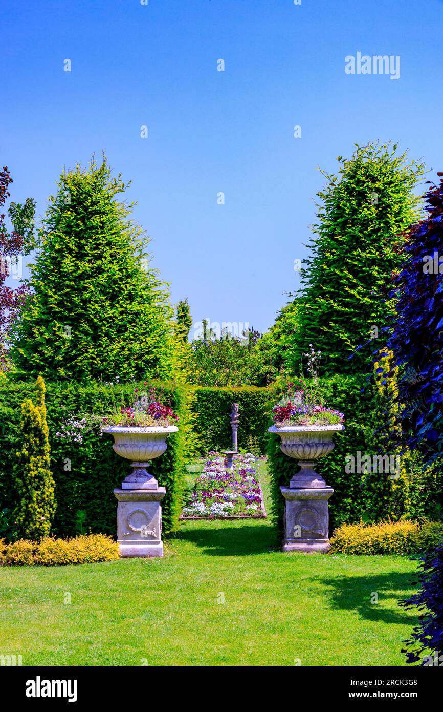The distinctive high hedges and colourful central border of the Canal