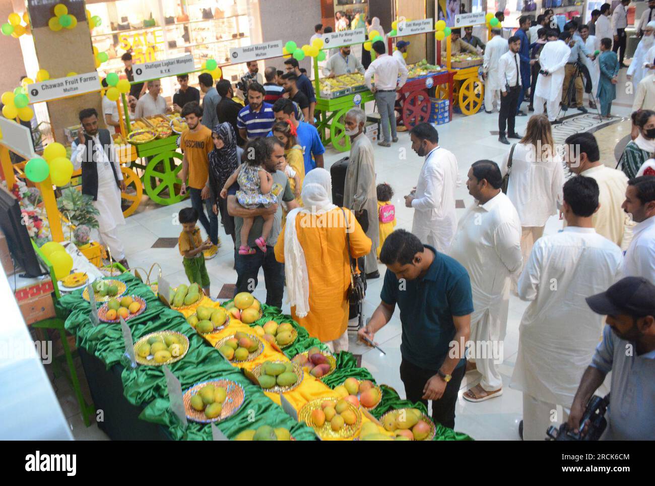 Islamabad. 14th July, 2023. People visit a mango festival in Islamabad, Pakistan on July 14, 2023. Credit: Ahmad Kamal/Xinhua/Alamy Live News Stock Photo