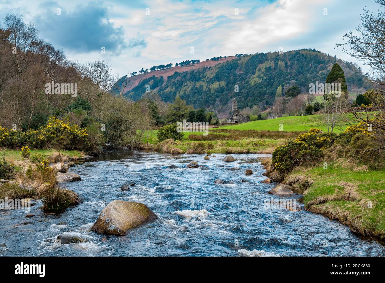 The River Flowing with St. Kevin's Kitchen in the Background, Glendalough, County Wicklow, Republic of Ireland Stock Photo