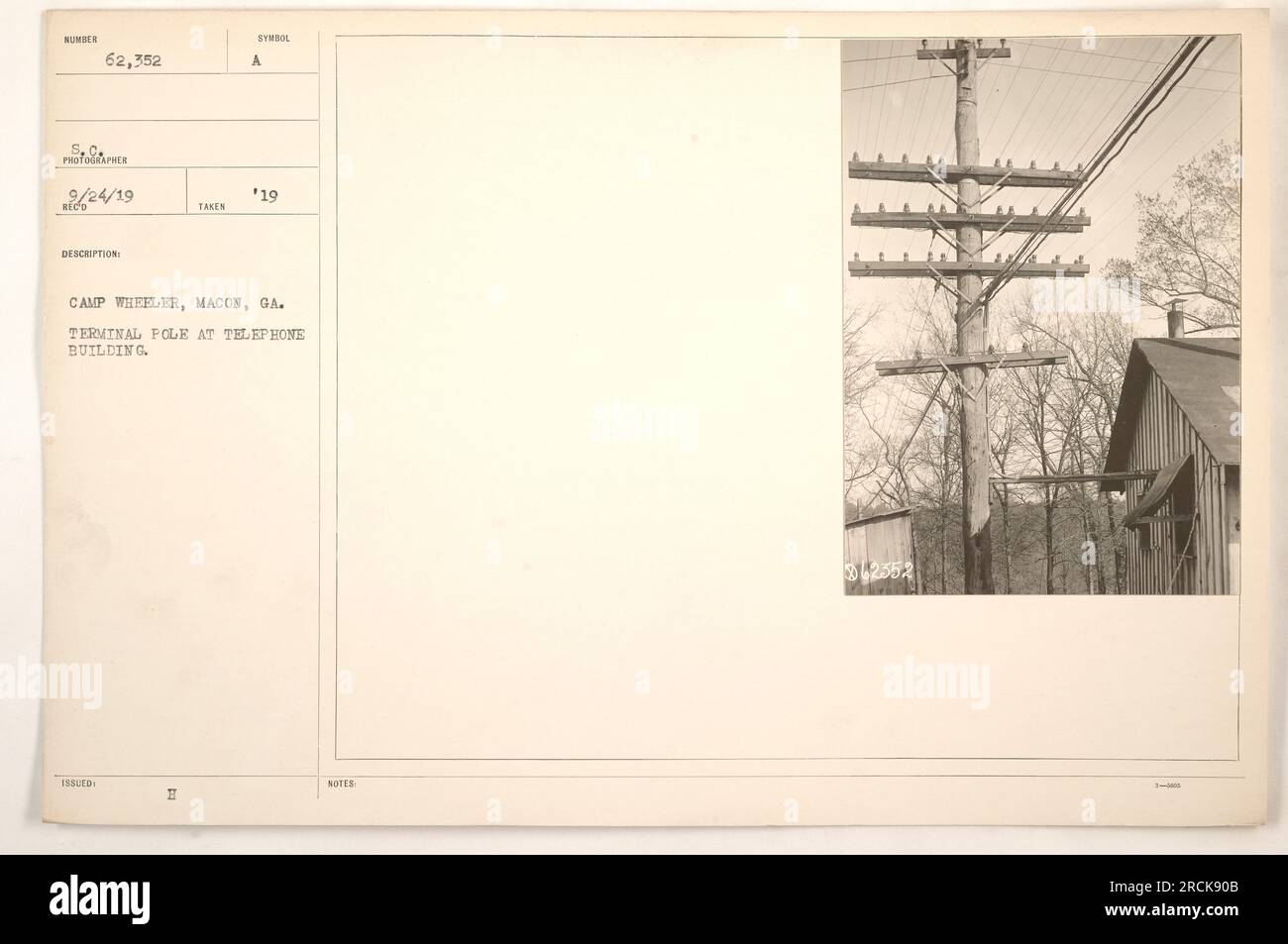Terminal pole at telephone building in Camp Wheeler, Macon, GA. The photograph was taken by photographer St. C on 9/24/19. The building is identified with the number 62,352. The image is part of a collection documenting American military activities during World War One. Notes indicate reference number 342552. Stock Photo